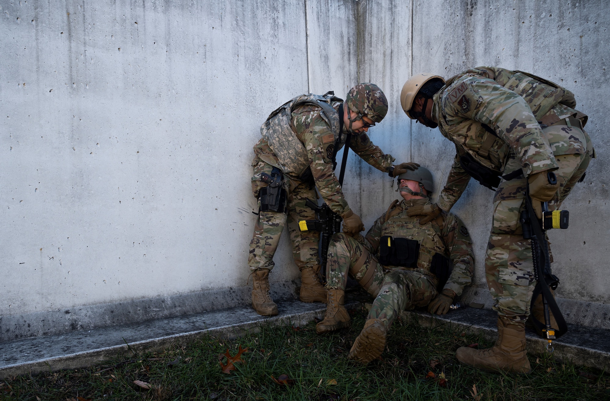 Service members treat patient