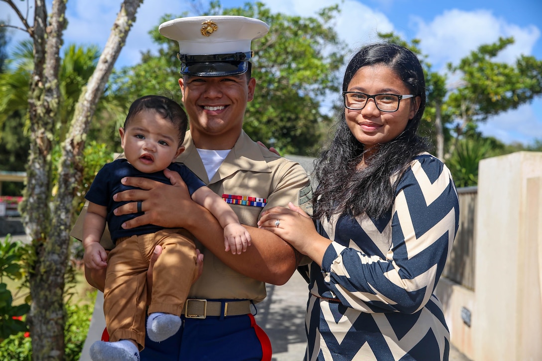 U.S. Marine Corps Cpl. Donald Pangelinan, training non-commissioned officer for Marine Corps Base Camp Blaz, poses for a photo with his wife Tatiana and son while on Guam, March 26, 2022. Corporal Pangelinan’s hometown is Tanapag, Saipan, and he is a graduate from Marianas High School. (U.S. Marine Corps photo by Gunnery Sgt. Rubin J. Tan)
