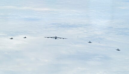 A bilateral formation of two Japanese Air Self-Defense Force F-15s, U.S. Air Force F-35As from Eielson Air Force Base, Alaska, and a B-52H Stratofortress, from Barksdale Air Force Base, Louisiana, fly over the Indo-Pacific region during a mission, Feb. 24, 2022.  The U.S. routinely and visibly demonstrates commitment to our allies and partners through the global employment of our military forces. (U.S. Air Force photo by Master Sgt. Burt Traynor)