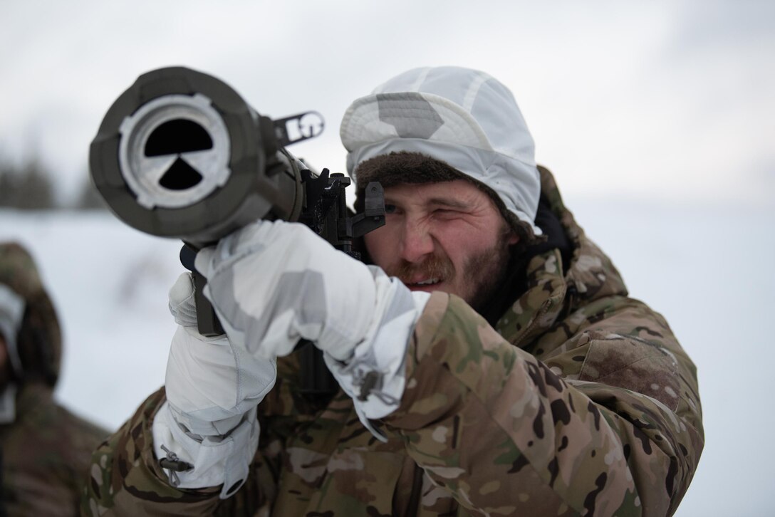 Tech. Sgt. Austin Sanders, a pararescuman with the Kentucky Air National Guard’s 123rd Special Tactics Squadron, looks through the sights of a Carl-Gustaf recoilless rifle in Grubbnäsudden, Sweden, Jan. 12, 2022. Fifteen members from the 123rd STS — including combat controllers; pararescuemen; special reconnaissance personnel; search, evasion, resistance and escape troops; and support Airmen — came here to build upon their relationship with European partners during an arctic warfare training course. (U.S. Air National Guard photo by Phil Speck)