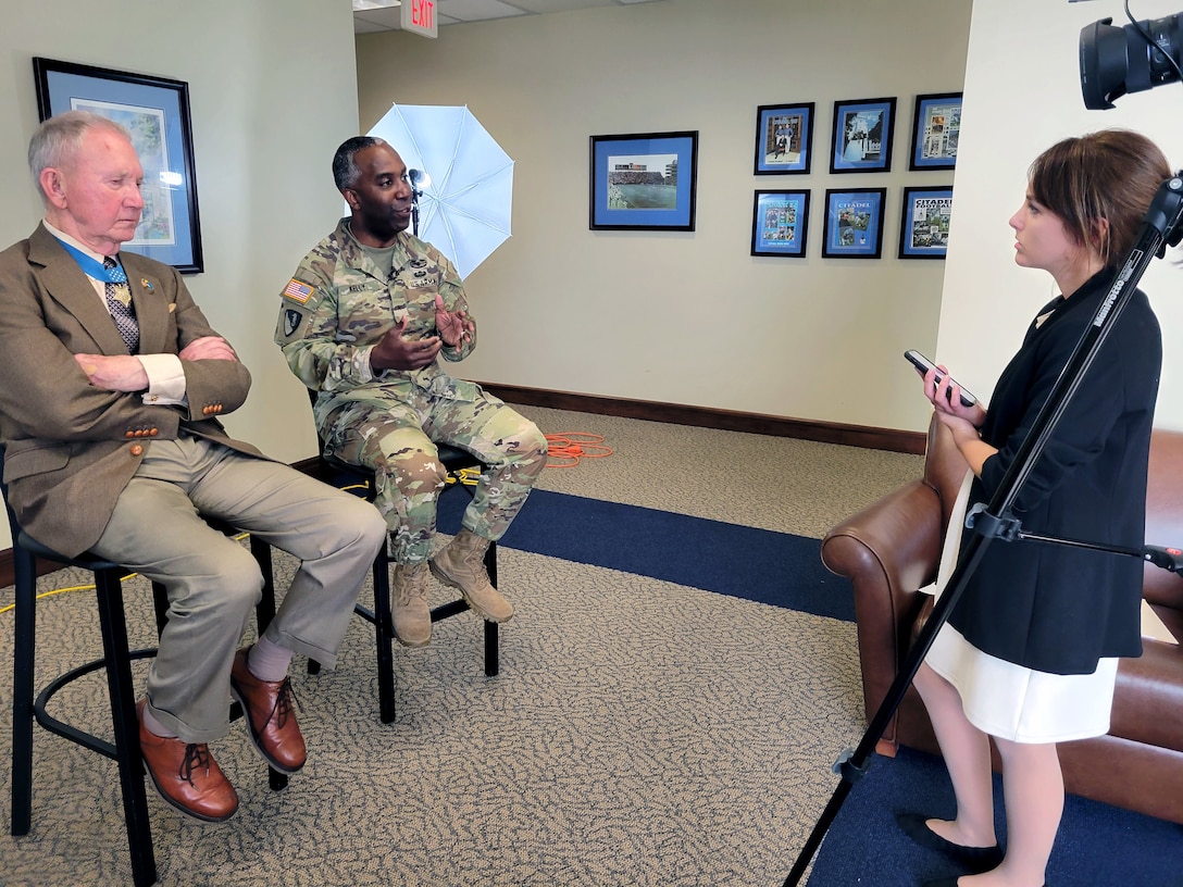Jackie Pennoyer, a public affairs specialist with the U.S. Army Corps Of Engineers Charleston District, interviews U.S. Marine Corps Maj. Gen. (retired) James Livingston (left) and U.S. Army Brig. Gen. Jason Kelly, commander of the U.S. Army Corps Of Engineers South Atlantic Division.  Livingston, a Medal Of Honor recipient, was a keynote speaker during the division's recent military Leadership Development Program.  Charleston District hosted the event.
