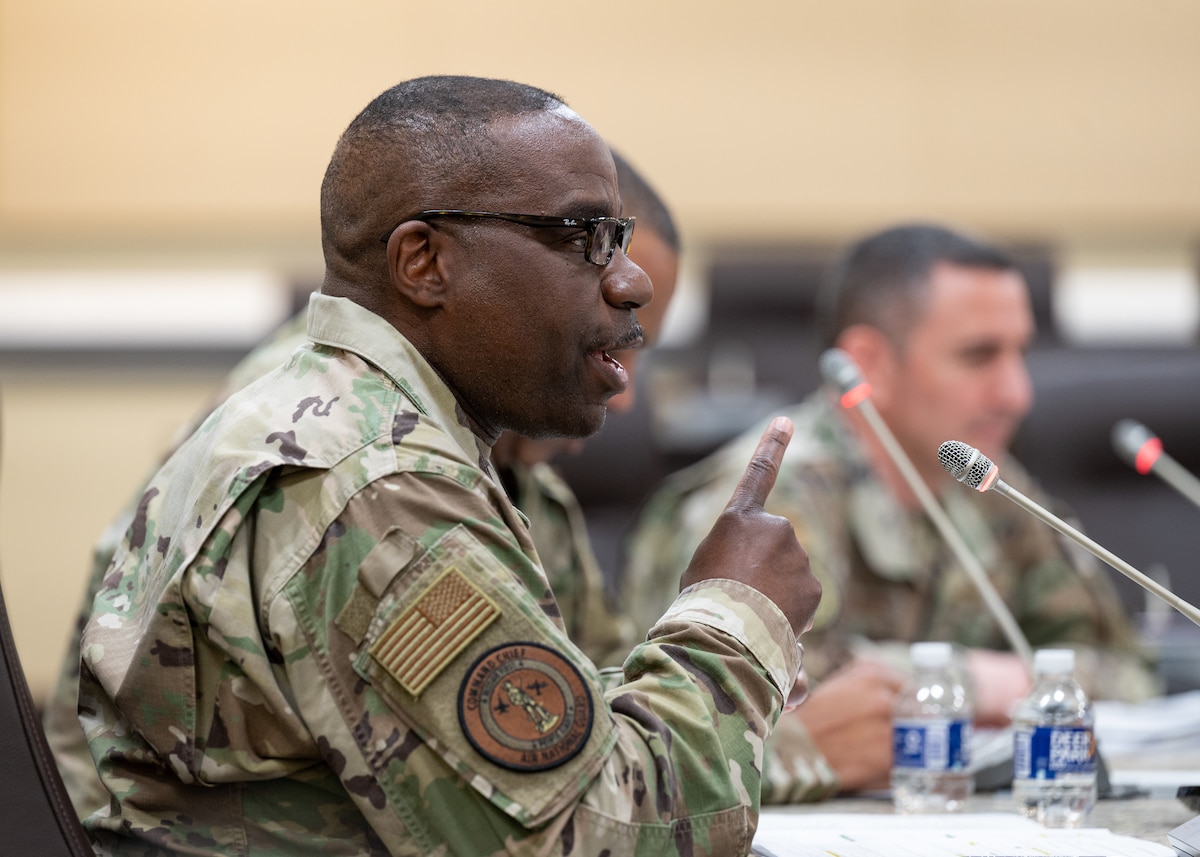 U.S. Air Force Chief Master Sgt. Maurice L. Williams, command chief, Air National Guard, answers a question during the Senior Enlisted Leadership Panel segment of a Total Force Integration Symposium at the General Jacob E. Smart Center on Joint Base Andrews, Maryland, March 22, 2022. Williams joined Chief Master Sgt. Timothy C. White, command chief, Air Force Reserve Command, and Chief Master Sgt. Brian P. Knuzelnick, command chief, Air Mobility Command, in the moderated panel to discuss the challenges, successes, and coming initiatives affecting Total Force Airmen. (U.S. Air National Guard photo by Staff Sgt. Sarah M. McClanahan)