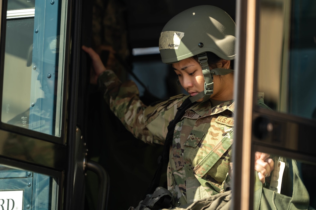 Airman gets off bus