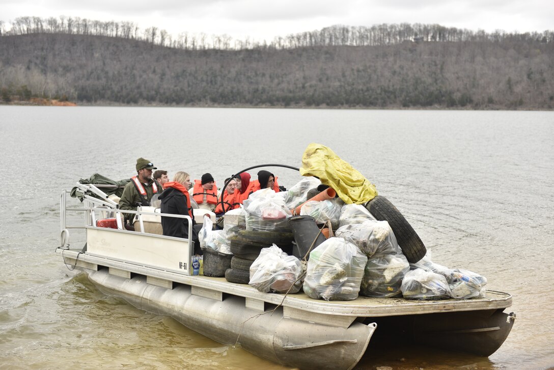 A pontoon boat is loaded with trash and debris at the Austin Bottom Boat Access. (USACE Photo by HEATHER KING)