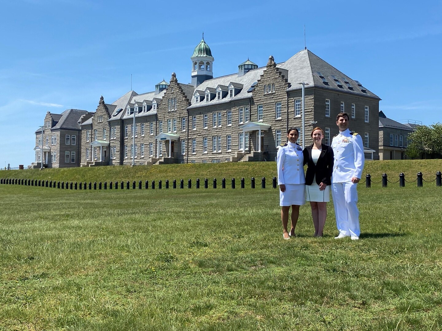 IMAGE: Naval Surface Warfare Center Dahlgren Division Lead Systems Engineer Emily Hester poses with Naval War College classmates Lt. Cmdr. Tamara Alvarado and Lt. Cmdr. Duncan McColl. Hester studied at the Naval War College as a Bundy Scholar and learned alongside military personnel during her time in the program.