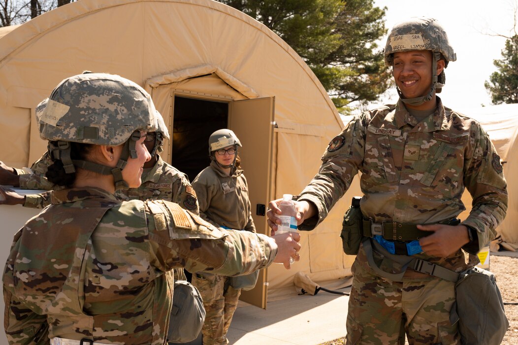 Airmen smile at each other