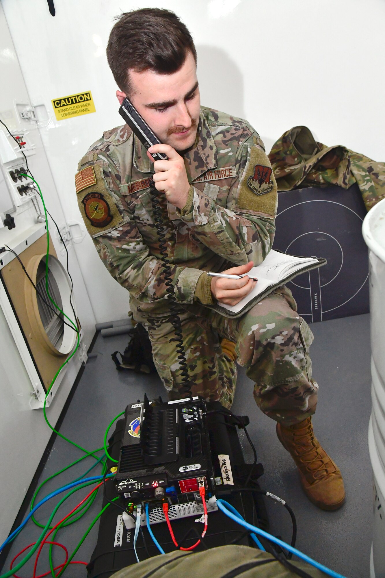 A photo of Airmen setting up communications gear