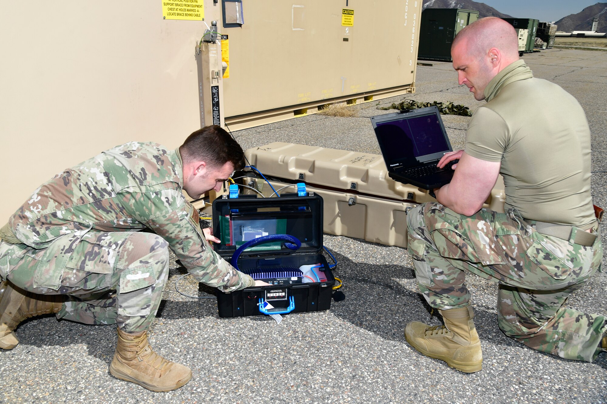 A photo of Airmen setting up communications gear