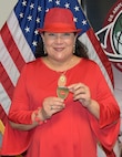 Migdalia “Miggy” Boyle poses with a 4-star commander’s coin presented virtually Feb. 10 by Gen. Ed Daly, commanding general of U.S. Army Materiel Command. Boyle, inventory manager for the Army’s Medical Chemical Defense Materiel program, will retire in May, capping off a 38-year career in federal service, including the past 16 years with the U.S. Army Medical Materiel Agency at Fort Detrick, Maryland.