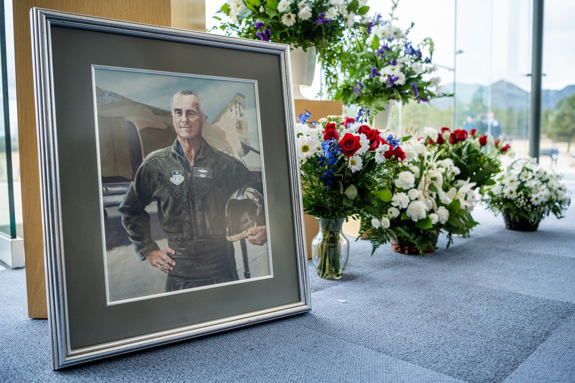 A static display of Lieutenant General Winfield Scott rests besides bouquets of flowers during Scott's funeral service at the Air Force Academy's Memorial Pavilion, Colo., March 29, 2022.