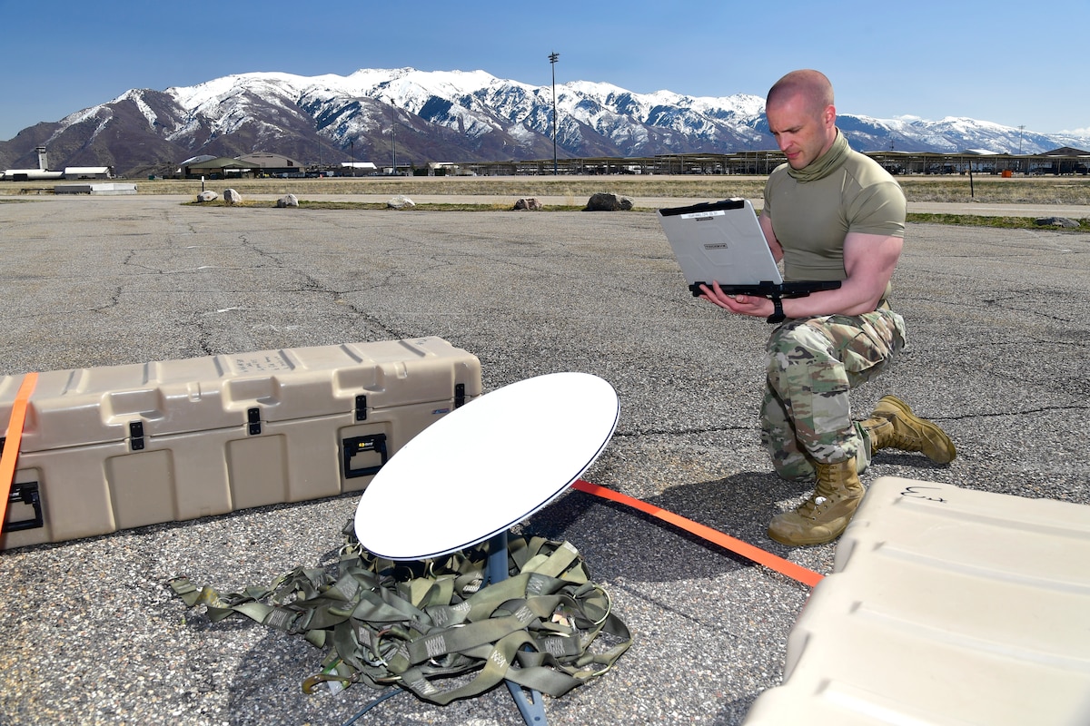 A photo of Airmen setting up communications gear