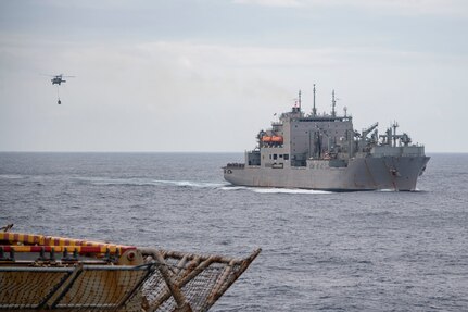 PHILIPPINE SEA (Feb. 4, 2022) Dry cargo and ammunition ship USNS Richard E. Byrd (T-AKE 4) conducts a vertical replenishment (VERTREP) with Wasp-class amphibious assault ship USS Essex (LHD 2) in support of Noble Fusion, Feb. 4, 2022. Noble Fusion demonstrates that Navy and Marine Corps forward-deployed stand-in naval expeditionary forces can rapidly aggregate Marine Expeditionary Unit/Amphibious Ready Group teams at sea, along with a carrier strike group, as well as other joint force elements and allies, in order to conduct lethal sea-denial operations, seize key maritime terrain, guarantee freedom of movement, and create advantage for U.S. partner and allied forces. Naval Expeditionary forces conduct training throughout the year in the Indo-Pacific, to maintain readiness. (U.S. Navy photo by Mass Communication Specialist 3rd Class Isaak Martinez)