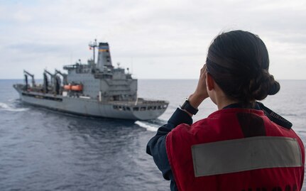 PHILIPPINE SEA (Feb. 4, 2022) Ens. Sophia Murillo, a native of Covina, Calif., assigned to Wasp-class amphibious assault ship USS Essex (LHD 2), uses a laser rangefinder aboard Essex during a replenishment-at-sea with fleet replenishment oiler USNS Yukon (T-AO 202) in support of Noble Fusion, Feb. 4, 2022. Noble Fusion demonstrates that Navy and Marine Corps forward-deployed stand-in naval expeditionary forces can rapidly aggregate Marine Expeditionary Unit/Amphibious Ready Group teams at sea, along with a carrier strike group, as well as other joint force elements and allies, in order to conduct lethal sea-denial operations, seize key maritime terrain, guarantee freedom of movement, and create advantage for U.S. partner and allied forces. Naval Expeditionary forces conduct training throughout the year in the Indo-Pacific, to maintain readiness. (U.S. Navy photo by Mass Communication Specialist 2nd Class Wesley Richardson)