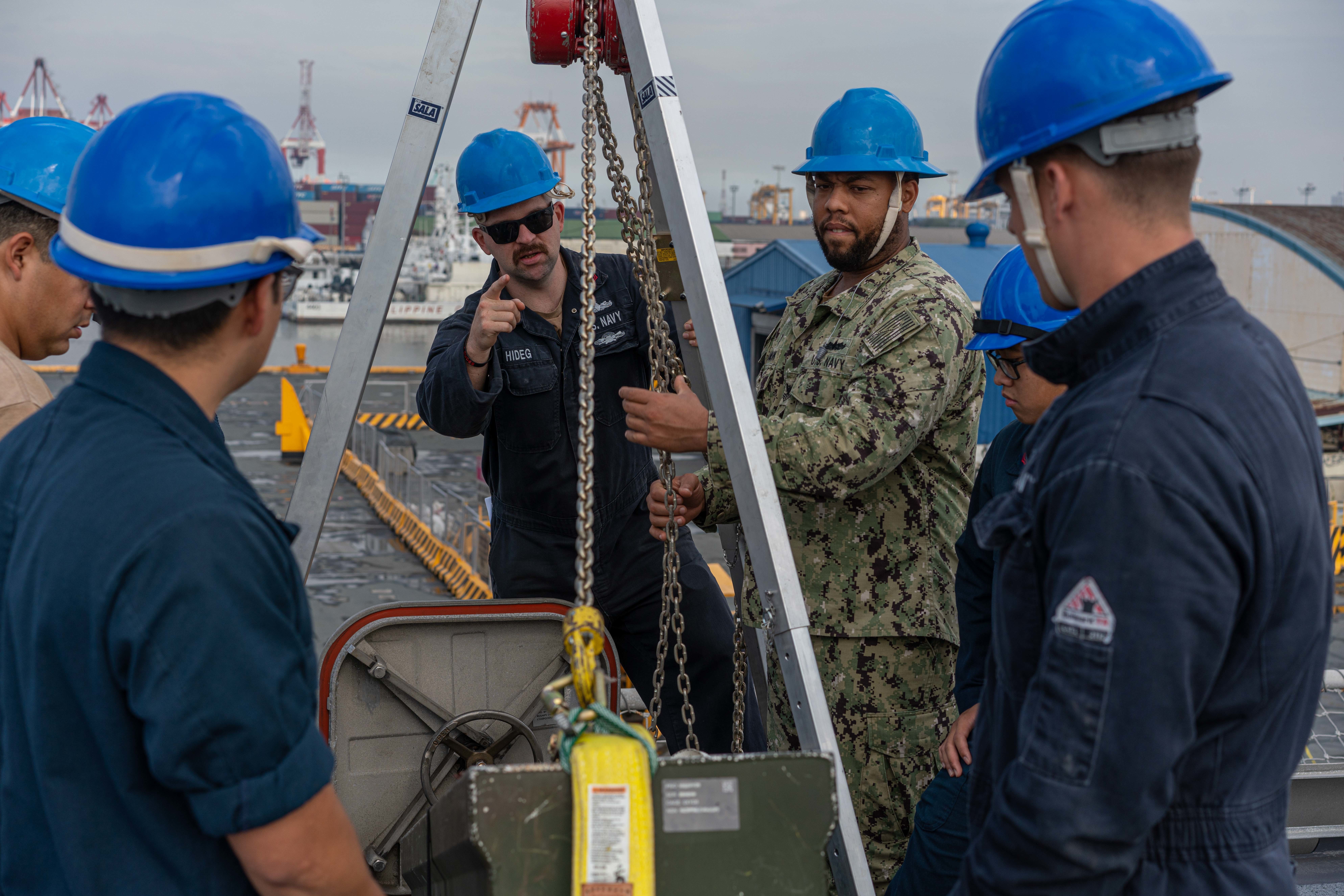 220208-N-FA490-1039 MANILA, Philippines (Feb. 8, 2022) – Gunner’s Mate 2nd Class Nick Hideg, center, from Youngstown, Ohio, serves as team leader as Sailors transport Captive Air Training Missiles (CATM) onto to the flight deck of the Independence-variant littoral combat ship USS Jackson (LCS 6). Attached to Destroyer Squadron (DESRON) 7, Jackson is on a rotational deployment to the U.S. 7th Fleet area of operations in support of security and stability in the region, and to work alongside allied and partner navies to provide maritime security and stability, key pillars of a free and open Indo-Pacific. (U.S. Navy photo by Mass Communication Specialist 3rd Class Andrew Langholf)