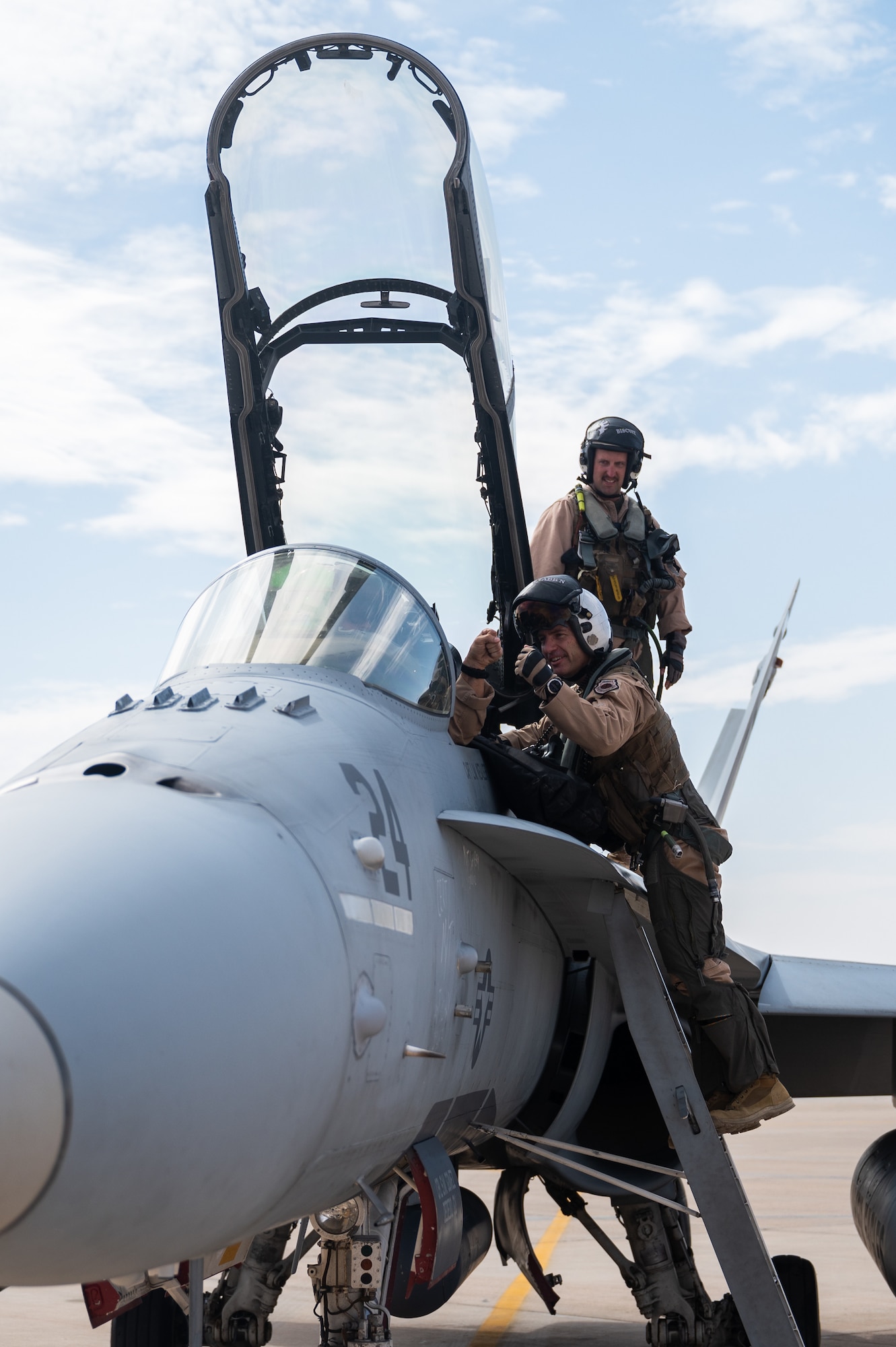 U.S. Air Force Brig. Gen. Robert Davis, 378th Air Expeditionary Wing commander, climbs into an F/A-18 Hornet at Prince Sultan Air Base, Kingdom of Saudi Arabia, Jan. 11, 2022. Davis flew with the Marine Fighter Attack Squadron 115 in order to better understand the role and capabilities of the VMFA-115 and the F/A-18. (U.S. Air Force photo by Senior Airman Jacob B. Wrightsman)