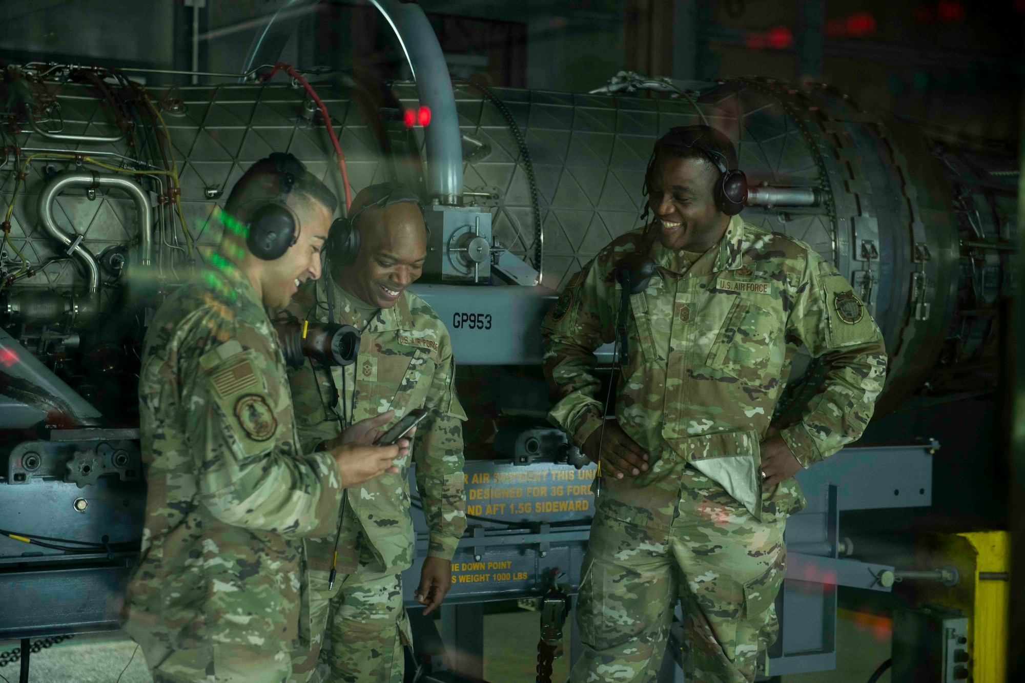 U.S. Air Force Chief Master Sgt. Carlos Damian, left, 18th Maintenance Group Superintendent, Chief Master Sgt. Ronnie Woods, middle, 18th Wing Command Chief, and Chief Master Sgt. Wendell J. Snider, right, U.S. Forces Japan Senior Enlisted Leader, prepare to exit the engine test cell