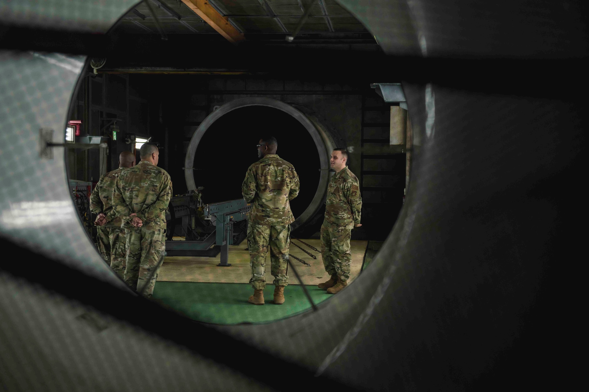 U.S. Air Force Chief Master Sgt. Wendell J. Snider, second from the right, U.S. Forces Japan Senior Enlisted Leader, speaks with Airmen from the 18th Component Maintenance Squadron about the engine test cell