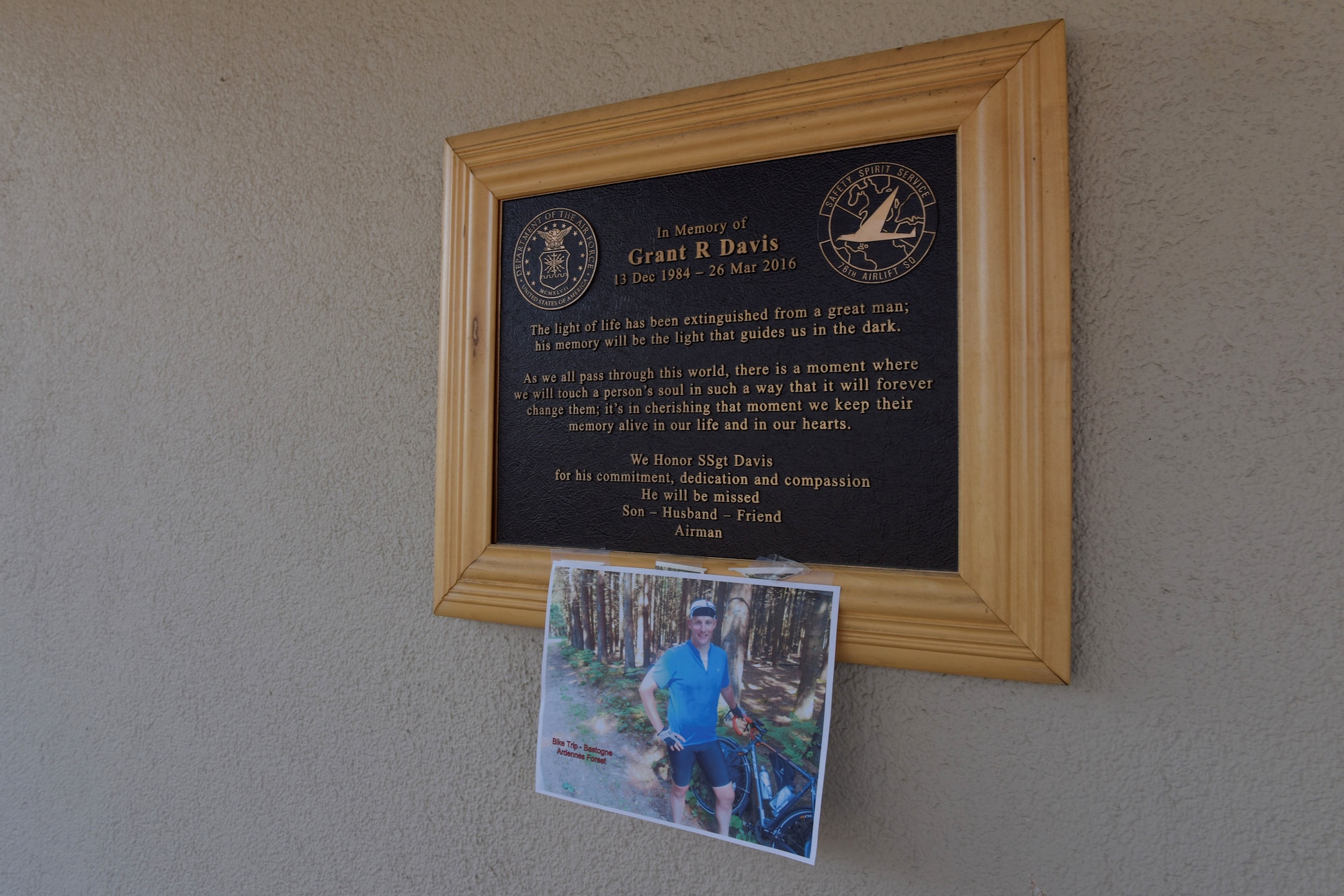 A plaque hangs on a wall