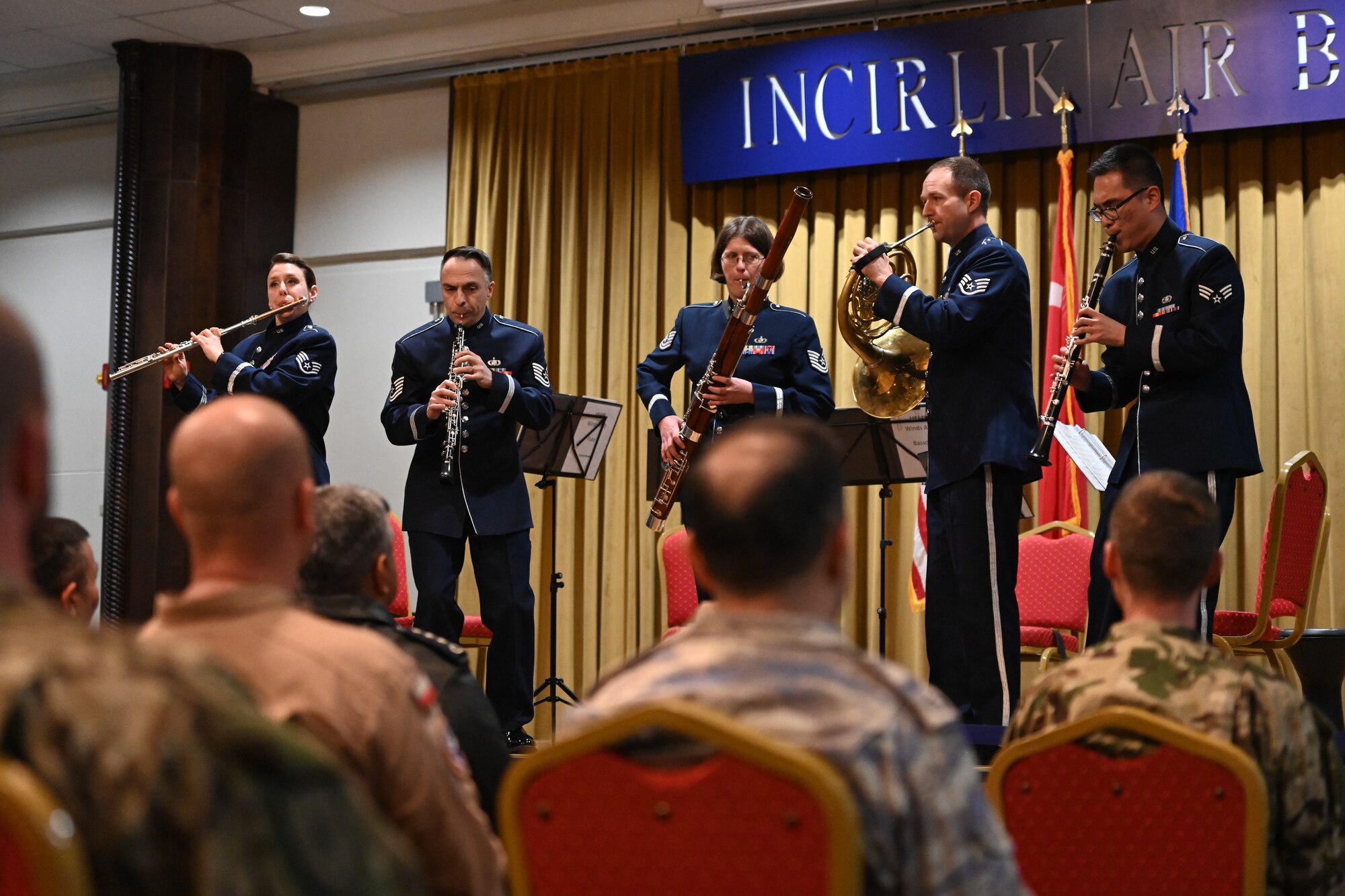 Musicians play on stage.