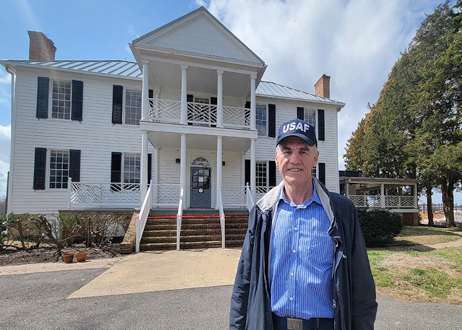 Robert Sheffield poses in front of the Bellwood Manor House