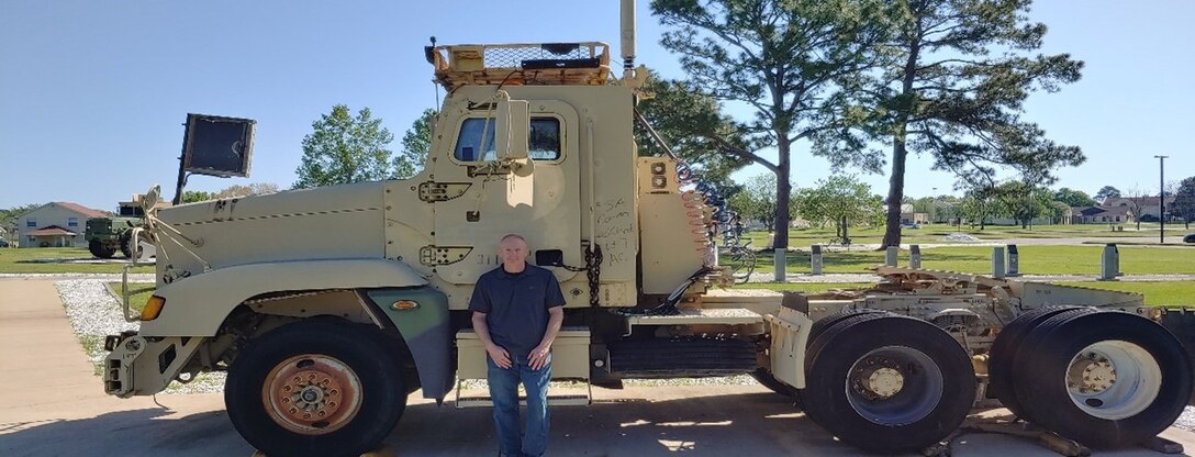 Man in front of a truck