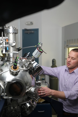 Nicholas Glavin, a senior materials scientist, with the Air Force Research Lab’s Materials and Manufacturing Directorate at Wright-Patterson Air Force Base, Ohio, uses AFRL’s custom magnetron sputtering system to fabricate and design new nanomaterials for Air Force applications Nov. 2, 2021. The system is capable of synthesizing materials down to the thickness of only a few atoms, where at that length scale, new and exciting properties emerge for future electronics and sensors. Glavin received the John L. McLucas Basic Research Award – Honorable Mention, as part of the 2021 Science, Technology, Engineering and Mathematics (STEM) awards announcement. He has been working with a team exploring the fundamental science behind two-dimensional materials.