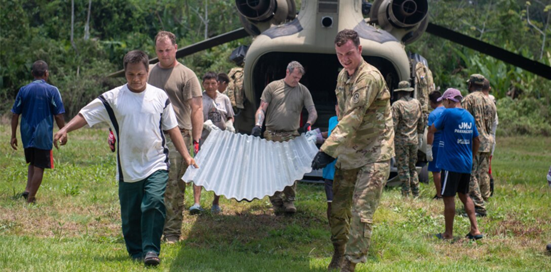Members of Joint Task Force-Bravo’s (JTF-B) 1st Battalion, 228th Aviation Regiment deliver construction supplies to citizens living in Manene, Panama.