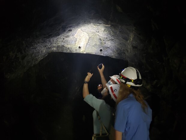 Army Fellows Olivia Finley, Justin Knight, & Nikki Lorvick examine the Granite Foundation underneath Dworshak Dam.