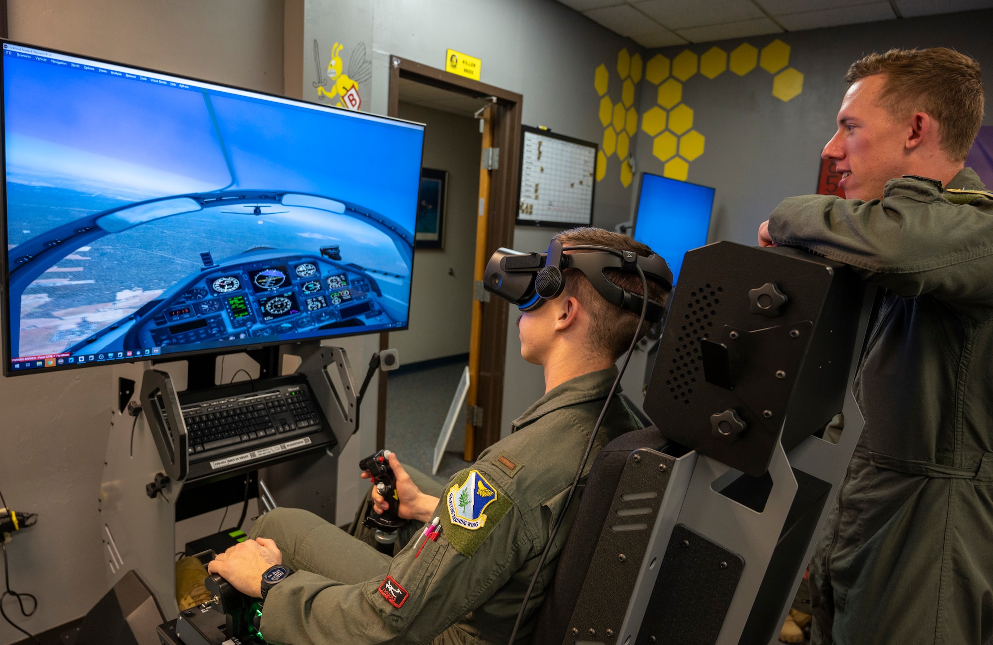 Pilots from the 85th Flying Training Wing Bee Flight use a Virtual Reality flight simulator to run maneuvers in the classroom on March 30, 2021, at Laughlin Air Force Base, Texas. Simulators in the classrooms help pilots work on specific parts of their training to improve. (U.S. Air Force photo by Senior Airman Nicholas Larsen)