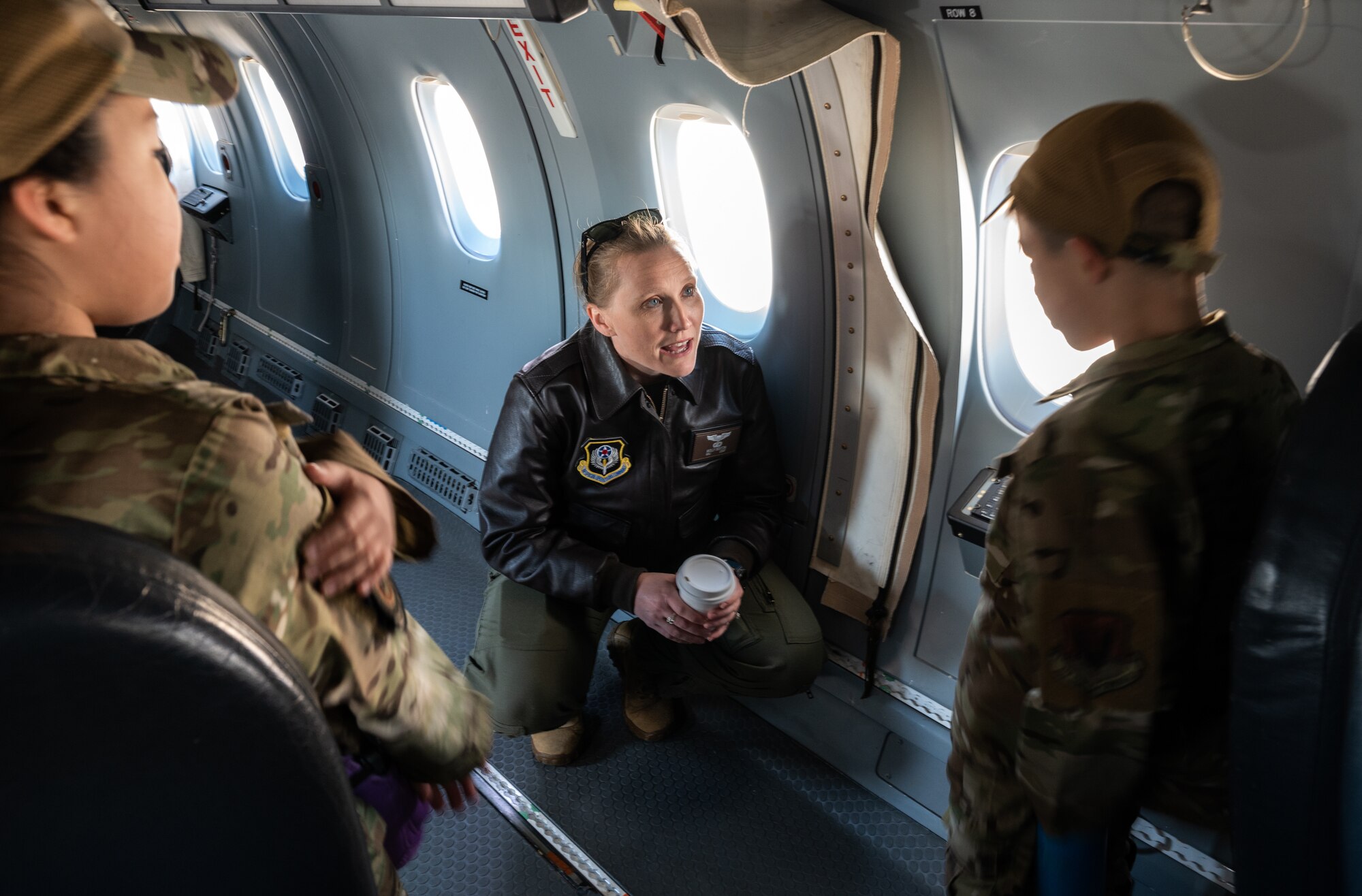 U.S. Air Force Maj. Molly Sexton, a 524th Special Operations Squadron instructor pilot, discusses the capabilities of the C-146A Wolfhound aircraft with some of the youth visiting a youth open house event March 12, 2022, at Moody Air Force Base, Georgia.