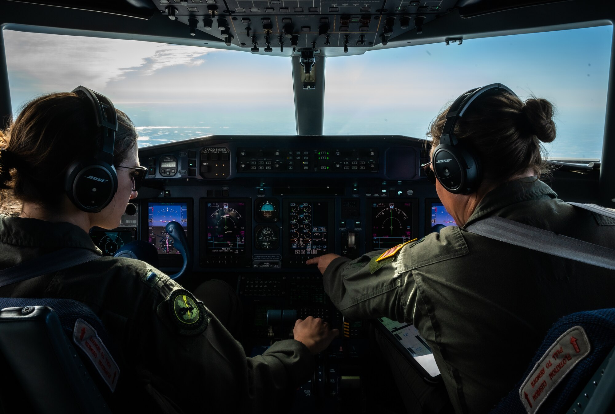 U.S. Air Force 1st Lt. Madeline Wawrzyniak, left, and U.S. Air Force Lt. Col. Heather Demis, right, aircraft commanders flying with the 524th Special Operations Squadron, pilot the C-146A Wolfhound after the Youth Open House March 12, 2022, at Moody Air Force Base, Georgia.