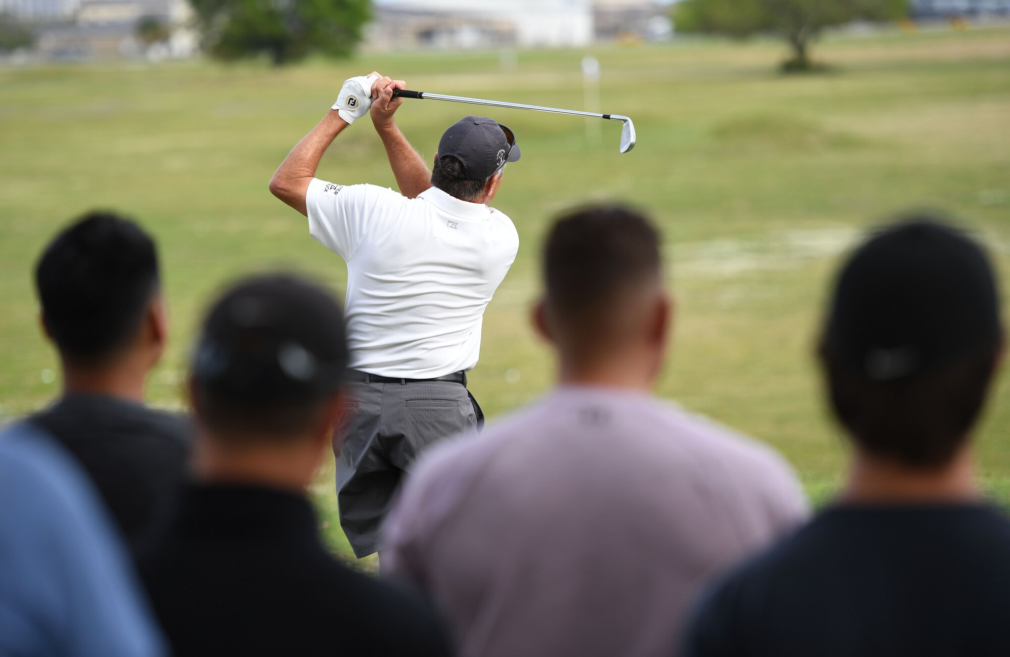 Scott Dunlap, Professional Golfers' Association champion player, provides golfing tips to Keesler personnel during a free clinic at the Bay Breeze Golf Course at Keesler Air Force Base, Mississippi, March 29, 2022. Dunlap is on the coast to compete in the 2022 Rapiscan Systems Classic at Grand Bear Golf Club. (U.S. Air Force photo by Kemberly Groue)