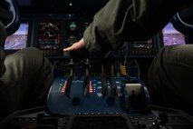 U.S. Air Force Lt. Col. Heather Demis, an aircraft commander flying with the 524th Special Operations Squadron, controls the gears of a C-146A Wolfhound during flight after the Youth Open House event March 12, 2022, at Moody Air Force Base, Georgia.