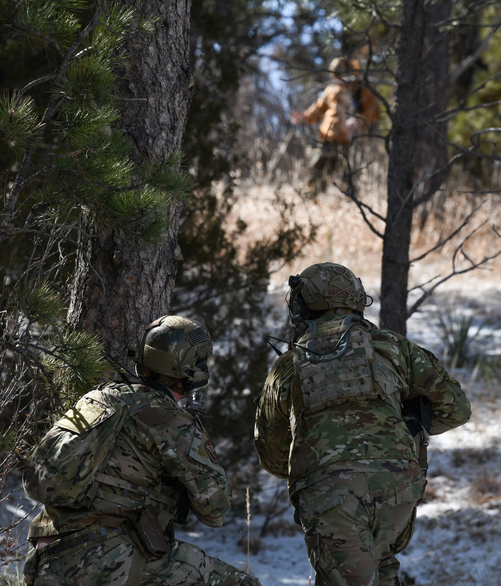 Convoy response force leaders from the 90th Missile Security Operations Squadron engage an adversary after a simulated payload transporter attack in Pine Bluffs, Wyoming, March 30, 2022. The 90th Security Forces Group conducted full mission profile training to further develop response capabilities to contingency situations during a PT movement. (U.S. Air Force photo by Airman 1st Class Charles Munoz)