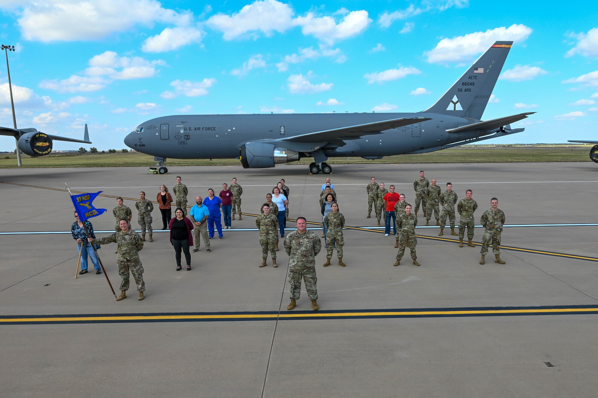 Members from the 97th Medical Group Healthcare Operations Squadron (HCOS) pose for a photo at Altus Air Force Base, Oklahoma, Oct. 22, 2021. The 97th HCOS oversees resource management, patient administration, medical information systems, medical logistics, medical readiness, pharmacy, laboratory and diagnostic imaging. (U.S. Air Force photo by Senior Airman Kayla Christenson)