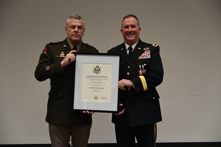 Brig. Gen. Tyler Smith receives his certificate of retirement from Maj. Gen. Michael Turley, adjutant general, Utah National Guard, at his retirement ceremony, March 14, 2022, at Camp Williams, Utah.