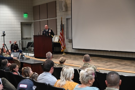 Brig. Gen. Tyler Smith, (right), receives a shadow box from the command team of the Utah National Guard showcasing awards and assignments from throughout his military career at his retirement ceremony, March 14, 2022