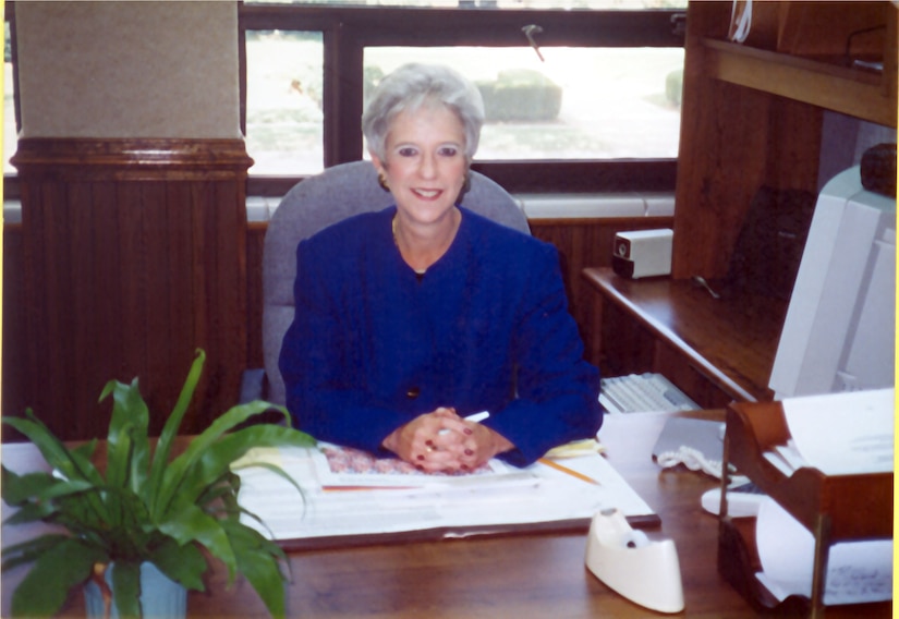 Mrs. Campbell sitting at her desk