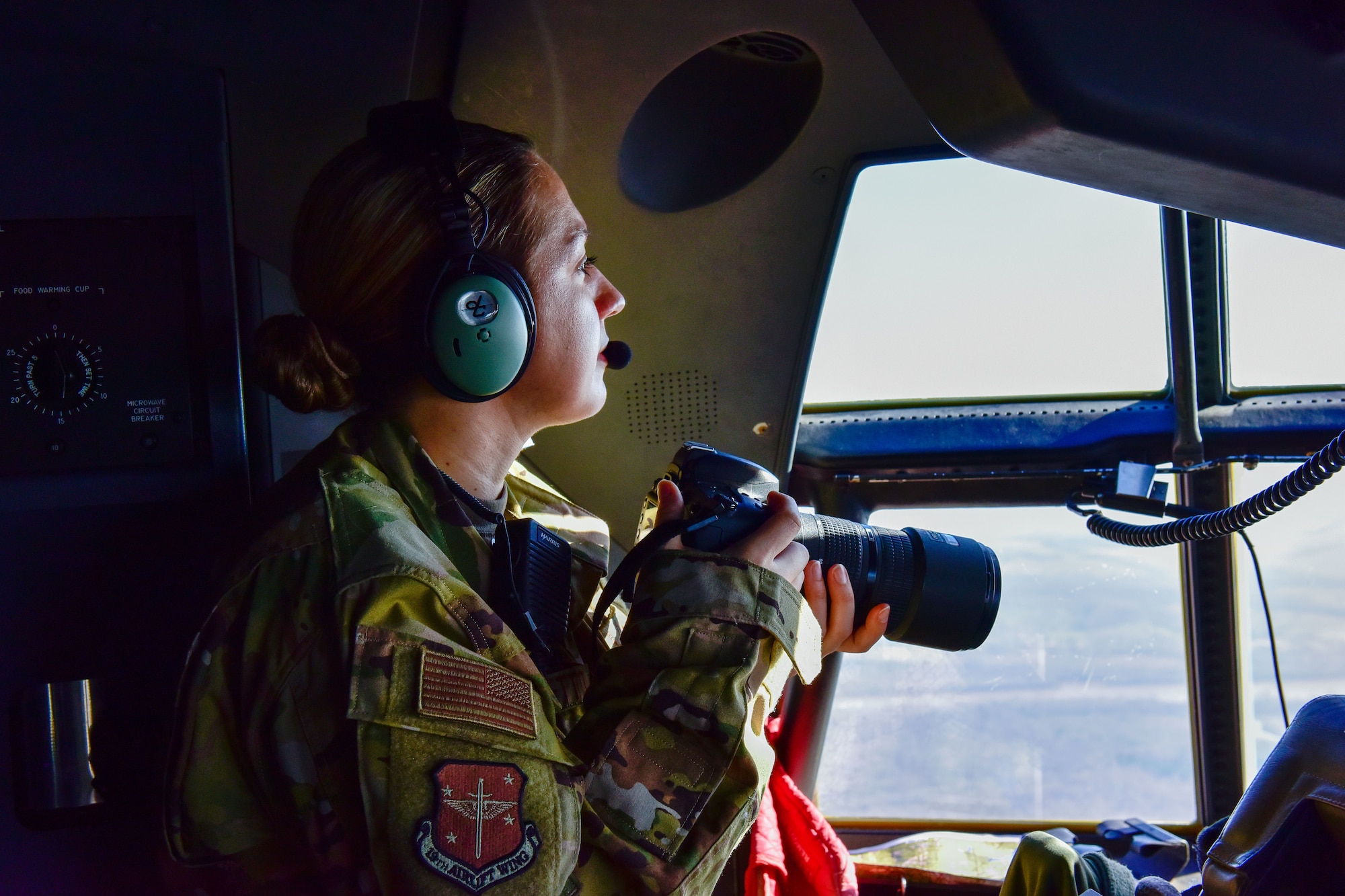 Then 1st Lt. Jessica Cicchetto, 19th Airlift Wing chief of public affairs, documents flight operations over Alexandria, Louisiana during Green Flag Little Rock 21-04