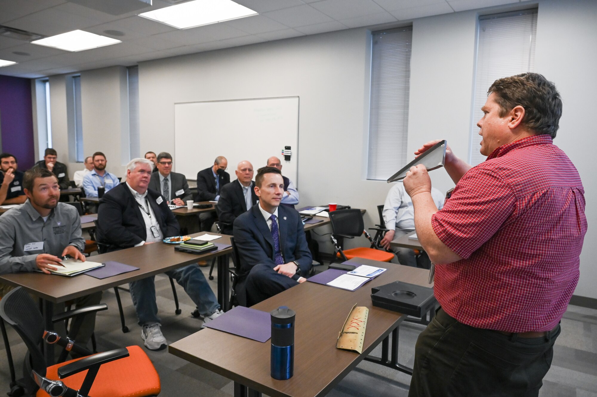 Kevin Ihrig, 309th Commodities Maintenance Group, presents his project to university representatives during a capstone project presentation March 31, 2022, at Hill Air Force Base, Utah. The capstone project matches senior undergraduate mechanical engineering students with an engineering project defined and funded by an industry sponsor. (U.S. Air Force photo by Cynthia Griggs)
