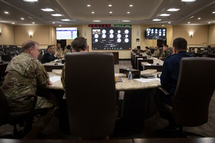 U.S. Air Force Airmen from across the globe tune in to a fireside chat featuring Lt. Gen. Richard W. Scobee, left, chief, Air Force Reserve, Lt. Gen. Kevin B. Schneider, middle, director of staff, Headquarters Air Force, and Lt. Gen. Michael A. Loh, right, director, Air National Guard, during the annual Total Force Integration Symposium at Joint Base Andrews, Maryland, March 22, 2022.