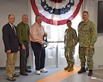 KITTERY, ME. March 30, 2022, Portsmouth Naval Shipyard cut the ribbon March 30 at Building 2, one of the oldest facilities at the shipyard (circa 1864), after completing major renovations.  Pictured (r to l) cutting the ribbon:  Shipyard Commander, Capt. Michael Oberdorf; Commander, Naval Facilities Engineering Systems Command - Atlantic, Rear Adm. Lore Aguayo; Nutmeg Companies, Inc. Mr. Jason Bugbee; Shipyard Nuclear Engineering and Planning Manager, Mr. Stephen Fahey, SES; and Oak Point Associates, Mr. Peter MacGovern. The Building 2 project provides a modern three story support facility while maintaining the historic character-defining architectural features of the original building. Building 2 is now a practical, and functional facility with improved ship servicing adjacencies and better day-to-day work flow, helping to increase productivity and to create a team building working environment.  (U.S. Navy photo by Jim Cleveland/Released)