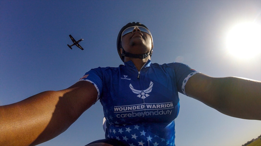 Airplane flies over RSM during cycling event.