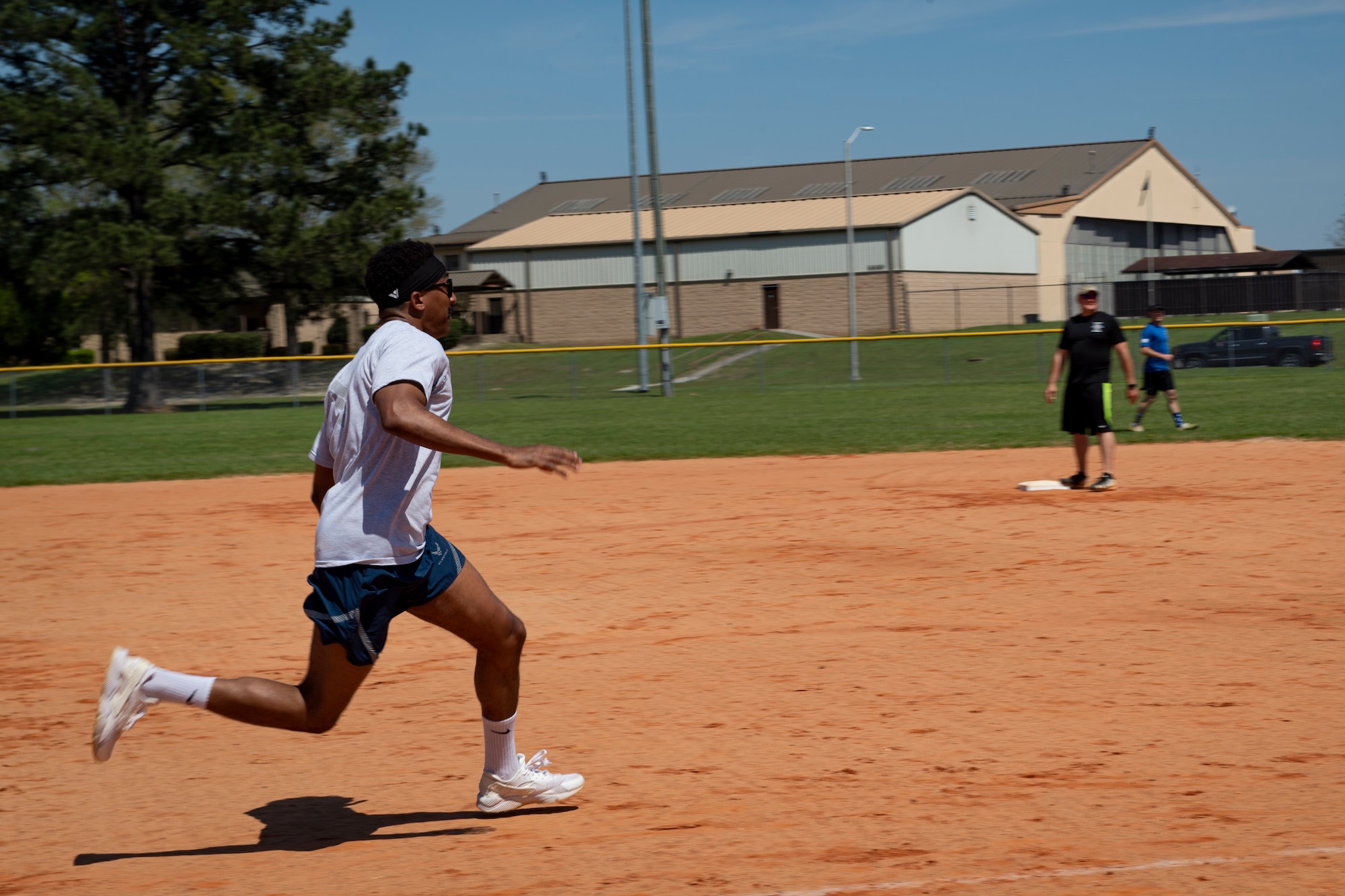 Photo of an Airman running during a kickball tournament