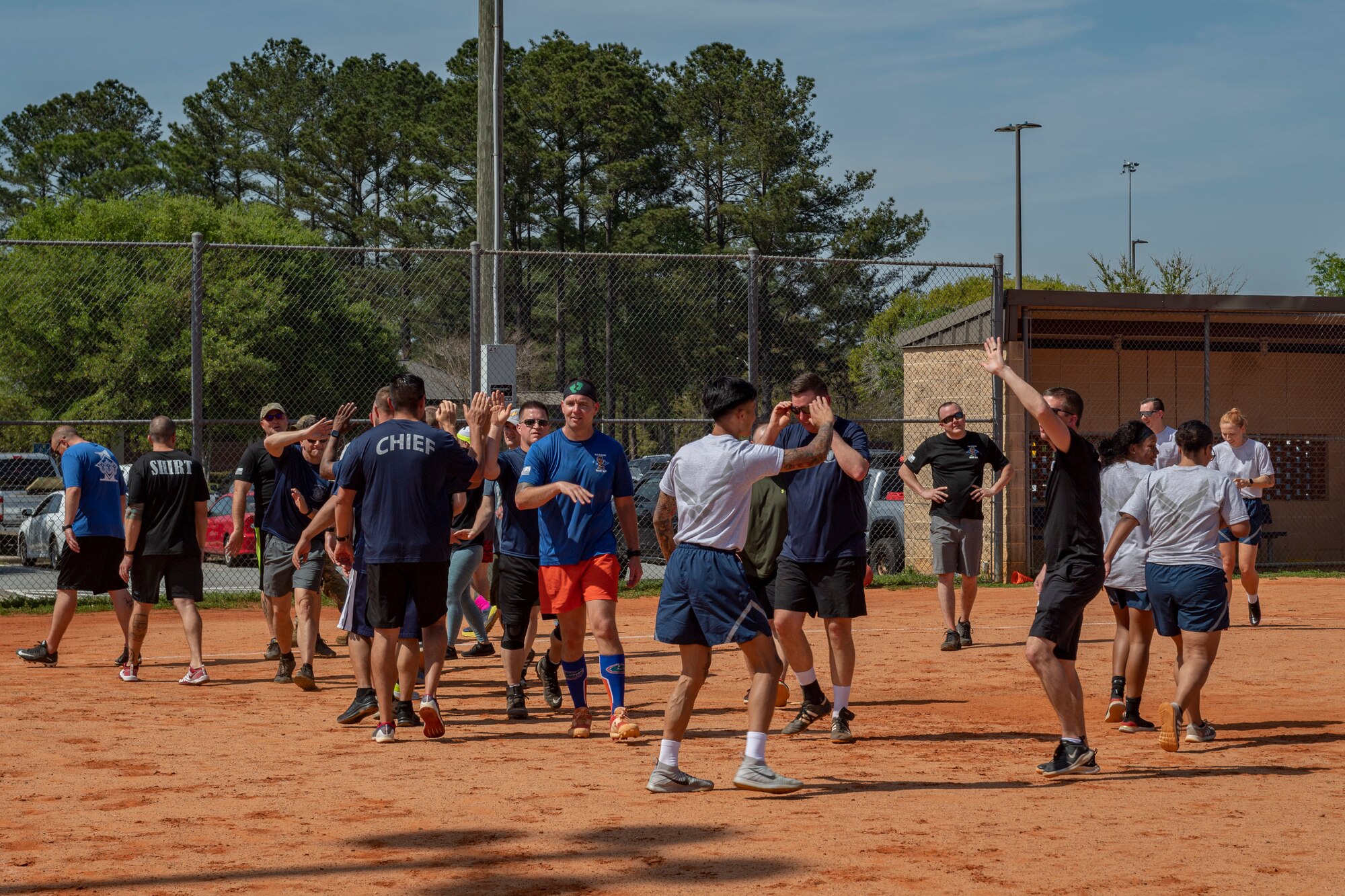 Photo of Airmen high fiving leadership