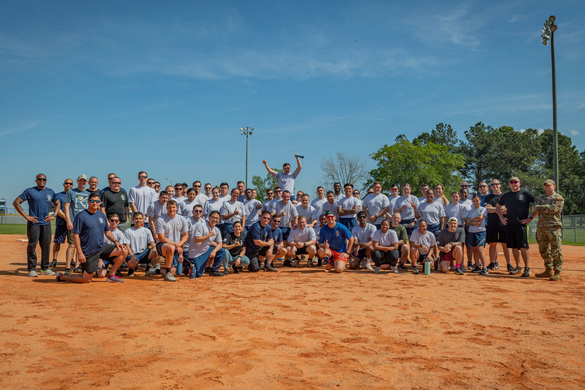 Photo of Airmen posing after a kickball tournament