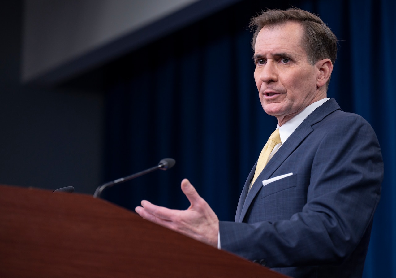 A man speaks from a podium.