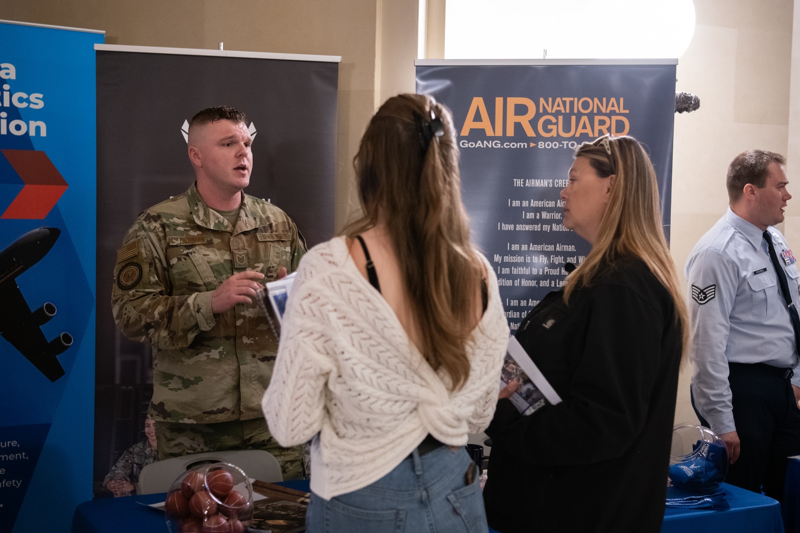 Tech. Sgt. Brandon Thurman, 138th Fighter Wing recruiter, speaks with attendees of AERO Oklahoma at the State Capitol building in Oklahoma City, March 30, 2022. The purpose of the day was to recognize the state’s aviation, aerospace, and defense industry as a vital economic engine for the state and provided a unique opportunity for industry officials to come together and meet with state legislators and other elected officials to show them firsthand how the industry continues to solidify Oklahoma as a worldwide leader in aviation, aerospace, and aerospace and defense. (Oklahoma Air National Guard photo by Tech. Sgt. Rebecca Imwalle)