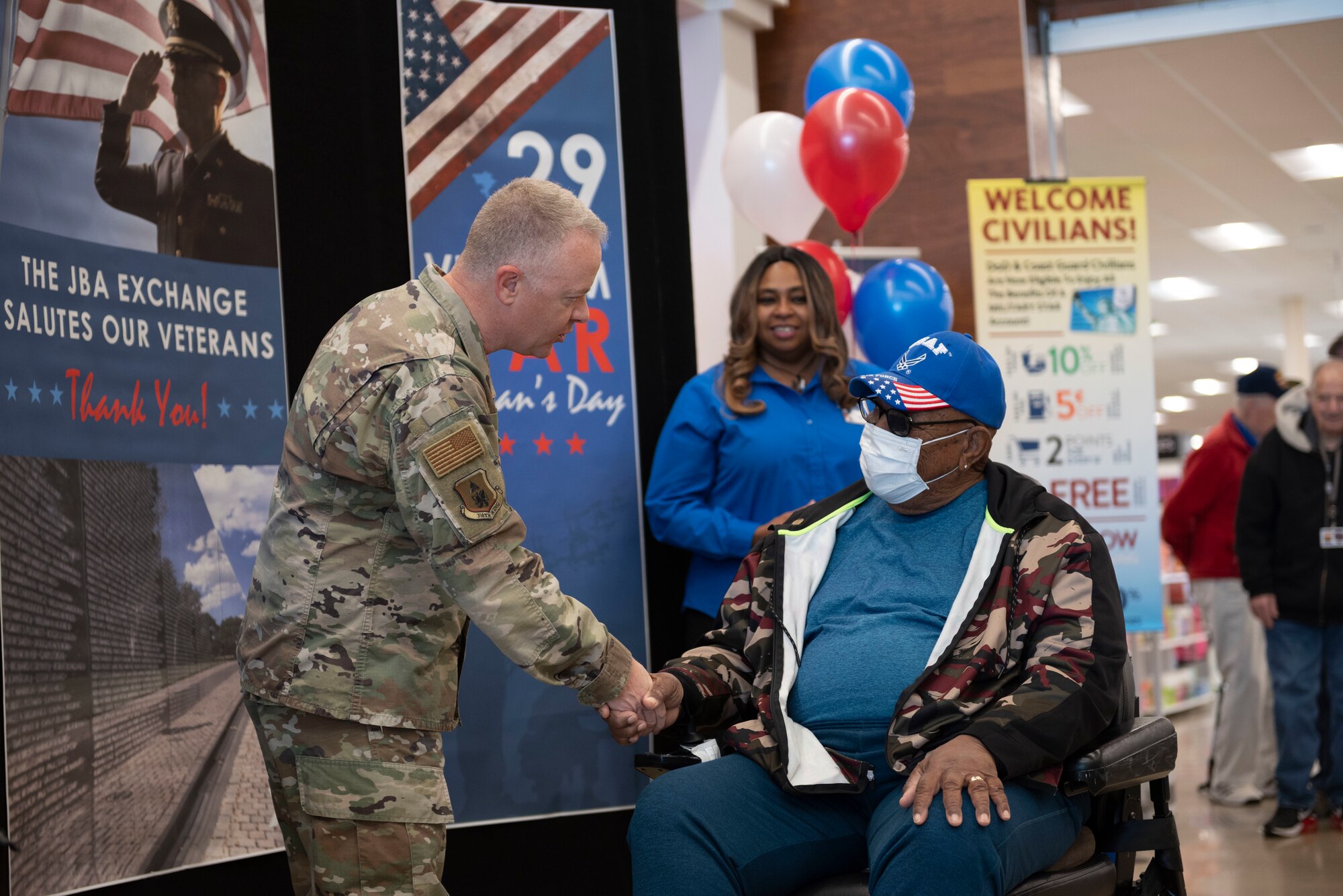 Col. Tyler Schaff, 316th Wing and installation commander, shakes hands with a Vietnam War veteran, March, 29, 2022 at Joint Base Andrews, Md.