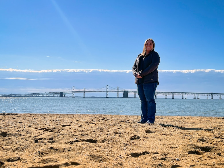 Kristina May, U.S. Army Corps of Engineers (USACE), Baltimore District, Biologist and USACE South Atlantic Coastal Study (SACS) Environmental Lead, examines environmental protection efforts near the Chesapeake Bay Bridge at Sandy Point State Park in Annapolis, Md., March 25, 2022. As a part of Women’s History Month, May pays tribute to past and current women leaders who’ve courageously reimagined the possible to help women in STEM achieve their goals. (U.S. Army photo by Greg Nash)